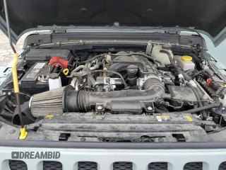 2023 Jeep Wrangler Sport with VIN 1C4HJXAG0PW595881, listed as a Copart auction lot 65590025 with 19,597 mi miles and Salvage title. Bid and sale history available at DreamBid. Image 12.