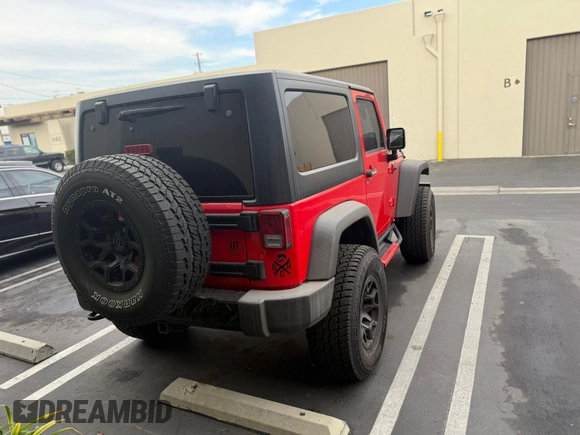 2015 Jeep Wrangler Sport with VIN 1C4AJWAG0FL750098, listed as a IAAI auction lot 41266454 with 77,115 mi miles. Bid and sale history available at carsss.com. Image 4.