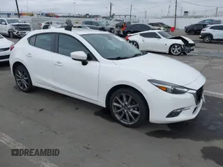 2018 Mazda 3 Grand Touring z VIN 3MZBN1M33JM169834, wystawiony jako IAAI lot #41867369 z przebiegiem 94 198 mil mil oraz . Historia ofert i sprzedaży dostępna na DreamBid. Obrazek 1.
