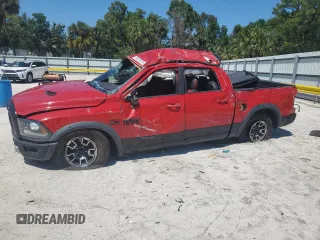 2016 Ram 1500 Rebel z VIN 1C6RR7YT2GS107013, wystawiony jako Copart lot #50229575 z przebiegiem 163 174 mil mil oraz Szkody całkowita. Historia ofert i sprzedaży dostępna na DreamBid. Obrazek 1.