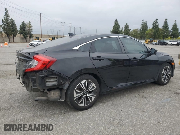 2016 Honda Civic EX-T z VIN 2HGFC1F33GH634029, wystawiony jako Copart lot #56026045 z przebiegiem 168 676 mil mil oraz Szkoda całkowita • Salvage title. Historia ofert i sprzedaży dostępna na DreamBid. Obrazek 3.