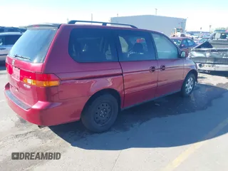 2004 Honda Odyssey EX with VIN 5FNRL18644B122591, listed as a IAAI auction lot 42207036 with 166,179 mi miles and . Bid and sale history available at DreamBid. Image 4.