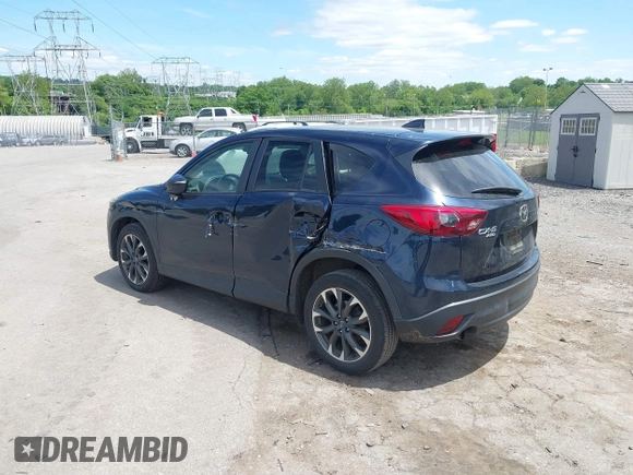 2016 Mazda CX-5 Grand Touring z VIN JM3KE4DY1G0817562, wystawiony jako IAAI lot #42289929 z przebiegiem 135 476 mil mil oraz . Historia ofert i sprzedaży dostępna na DreamBid. Obrazek 3.