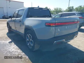 2022 Rivian R1T Adventure z VIN 7FCTGAAA2NN006053, wystawiony jako IAAI lot #41974199 z przebiegiem 286 mil mil oraz . Historia ofert i sprzedaży dostępna na DreamBid. Obrazek 3.