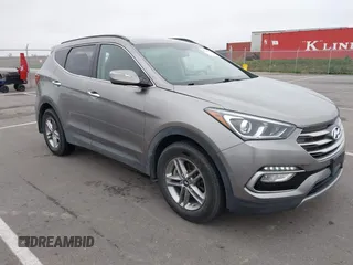 2018 Hyundai Santa Fe 2.4L z VIN 5XYZUDLB4JG512386, wystawiony jako IAAI lot #42114656 z przebiegiem 78 489 mil mil oraz . Historia ofert i sprzedaży dostępna na DreamBid. Obrazek 1.