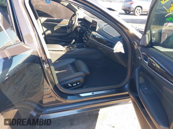 2018 BMW 5 Series M550i xDrive with VIN WBAJB9C57JG463933, listed as a IAAI auction lot 41295711 with 99,173 mi miles and . Bid and sale history available at carsss.com. Image 5.