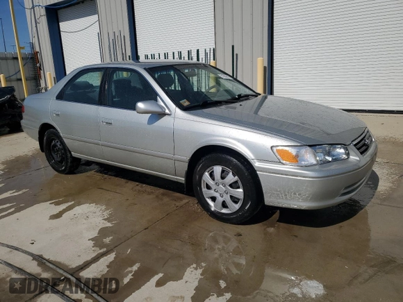 2000 Toyota Camry CE with VIN JT2BG22K9Y0520572, listed as a Copart auction lot 51062815 with 130,878 mi miles and Salvage Title. Bid and sale history available at DreamBid. Image 4.