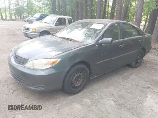2002 Toyota Camry LE z VIN 4T1BE32K12U619689, wystawiony jako IAAI lot #42222078 z przebiegiem 216 591 mil mil oraz . Historia ofert i sprzedaży dostępna na DreamBid. Obrazek 2.