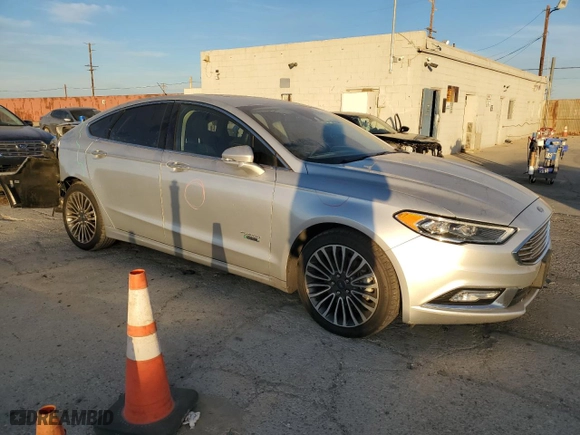 2017 Ford Fusion Energi Titanium with VIN 3FA6P0SUXHR379807, listed as a Copart auction lot 84885494 with 100,735 mi miles and Salvage Title. Bid and sale history available at carsss.com. Image 4.