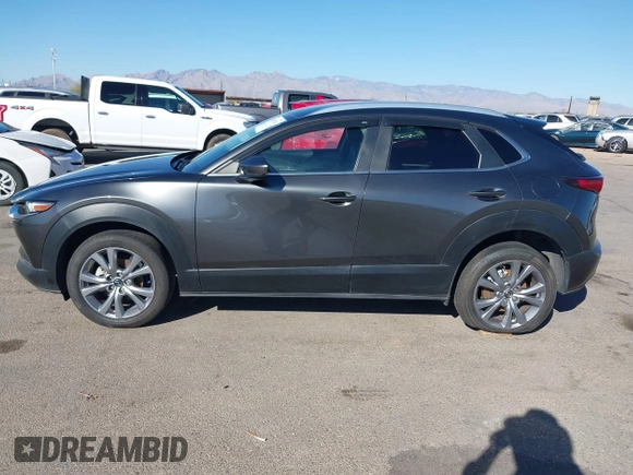 2022 Mazda CX-30 S Select z VIN 3MVDMBBL0NM415511, wystawiony jako IAAI lot #41513247 z przebiegiem Nie podano mil oraz . Historia ofert i sprzedaży dostępna na DreamBid. Obrazek 15.