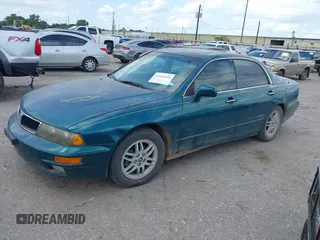 2001 Mitsubishi Diamante LS z VIN 6MMAP67P51T007599, wystawiony jako IAAI lot #42425149 z przebiegiem 115 132 mil mil oraz . Historia ofert i sprzedaży dostępna na DreamBid. Obrazek 2.