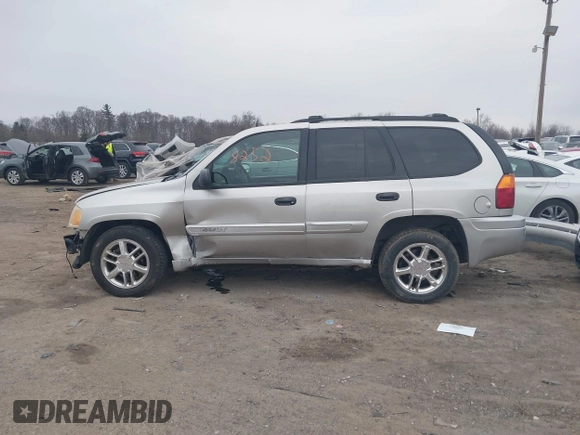 2004 GMC Envoy SLE with VIN 1GKDT13SX42135951, listed as a IAAI auction lot 41668252 with 216,193 mi miles. Bid and sale history available at carsss.com. Image 15.