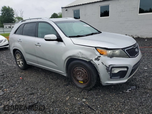 2011 Kia Sorento SX with VIN 5XYKW4A2XBG099857, listed as a Copart auction lot 56946015 with 195,457 mi miles and Salvage title. Bid and sale history available at DreamBid. Image 4.