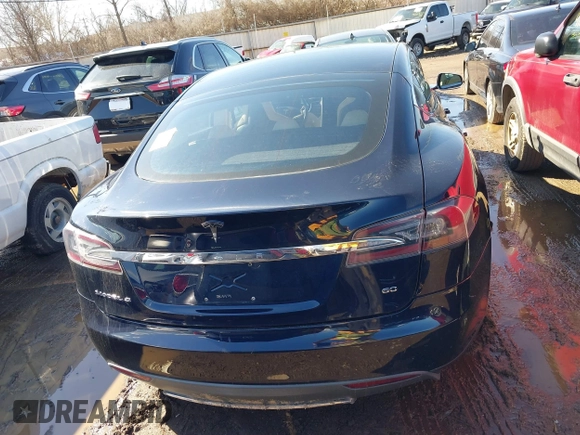 2013 Tesla Model S with VIN 5YJSA1CG2DFP14689, listed as a IAAI auction lot 41648508 with 98,578 mi miles and . Bid and sale history available at carsss.com. Image 15.