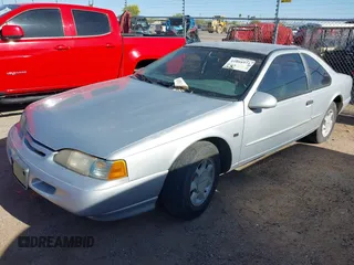 1995 Ford Thunderbird LX with VIN 1FALP62W8SH127506, listed as a IAAI auction lot 41808971 with 139,284 mi miles. Bid and sale history available at carsss.com. Image 2.