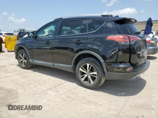 2018 Toyota RAV4 XLE with VIN 2T3WFREV2JW433186, listed as a Copart auction lot 61008705 with 57,310 mi miles and Salvage title. Bid and sale history available at DreamBid. Image 2.