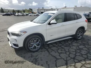 2017 BMW X1 sDrive28i with VIN WBXHU7C33H5H32827, listed as a Copart auction lot 50348265 with 117,412 mi miles and Salvage Title. Bid and sale history available at carsss.com. Image 1.