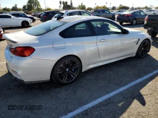2015 BMW M4 with VIN WBS3R9C55FK330561, listed as a Copart auction lot 40490133 with 65,127 mi miles. Bid and sale history available at carsss.com. Image 3.