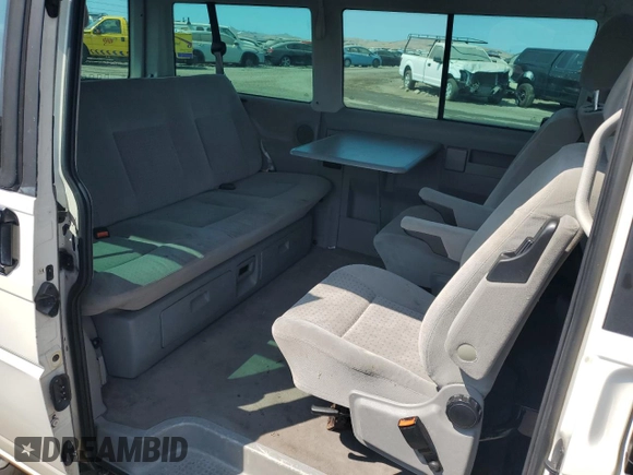 2003 Volkswagen EuroVan MV с VIN WV2MB47033H038192, выставлен на аукционе Copart как лот 67783954 с пробегом 176 595 миль миль и Списание • Salvage title. История ставок и продаж доступна на DreamBid. Изображение 11.