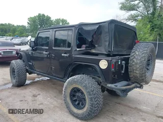 2013 Jeep Wrangler Unlimited Rubicon with VIN 1C4BJWFG5DL652050, listed as a IAAI auction lot 42451954 with 107,110 mi miles and . Bid and sale history available at DreamBid. Image 3.