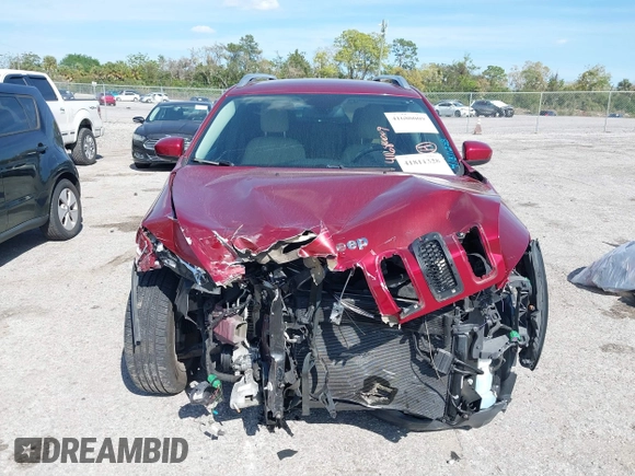 2015 Jeep Cherokee Latitude with VIN 1C4PJLCB0FW643402, listed as a IAAI auction lot 41811328 with 110,232 mi miles and . Bid and sale history available at DreamBid. Image 13.