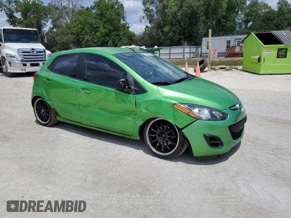 2012 Mazda 2 Sport with VIN JM1DE1KZ5C0141784, listed as a Copart auction lot 56498295 with 132,602 mi miles and Salvage Title. Bid and sale history available at DreamBid. Image 4.
