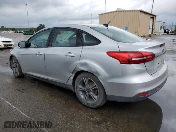 2016 Ford Focus SE with VIN 1FADP3FE5GL233081, listed as a Copart auction lot 65498195 with 89,674 mi miles and Salvage title. Bid and sale history available at DreamBid. Image 2.
