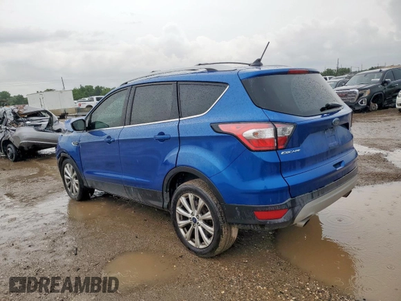 2018 Ford Escape Titanium with VIN 1FMCU9J98JUB31234, listed as a Copart auction lot 58817705 with 140,183 mi miles and Salvage title. Bid and sale history available at DreamBid. Image 2.