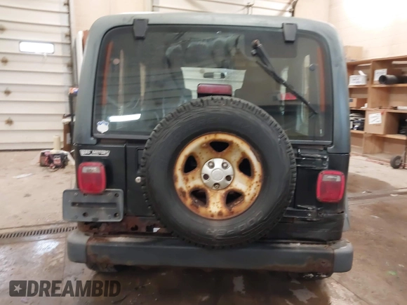 2003 Jeep Wrangler Sport Right Hand Drive with VIN 1J4F449S63P359031, listed as a IAAI auction lot 41495087 with 126,678 mi miles. Bid and sale history available at carsss.com. Image 16.