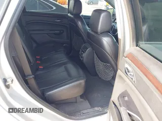 2014 Cadillac SRX Luxury Collection z VIN 3GYFNEE36ES652353, wystawiony jako IAAI lot #42233986 z przebiegiem 146 029 mil mil oraz . Historia ofert i sprzedaży dostępna na DreamBid. Obrazek 8.