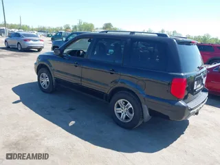 2005 Honda Pilot EX-L with RES with VIN 5FNYF18665B023730, listed as a IAAI auction lot 41989012 with 202,022 mi miles. Bid and sale history available at carsss.com. Image 3.