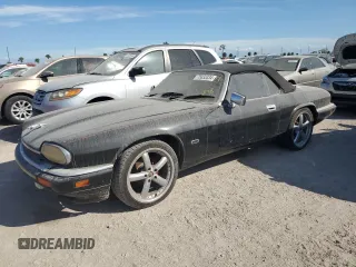 1995 Jaguar XJS with VIN SAJNX2748SC198836, listed as a Copart auction lot 75833334 with 145,794 mi miles and Salvage Title. Bid and sale history available at carsss.com. Image 1.