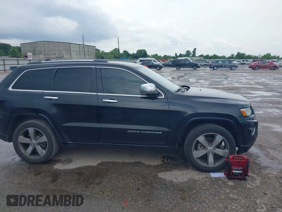 2015 Jeep Grand Cherokee Overland with VIN 1C4RJECG1FC769950, listed as a IAAI auction lot 42405712 with 217,514 mi miles and . Bid and sale history available at DreamBid. Image 13.