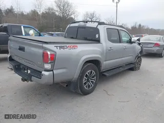 2020 Toyota Tacoma 4WD SR5 with VIN 3TMCZ5AN6LM306311, listed as a IAAI auction lot 41220025 with 67,806 mi miles. Bid and sale history available at carsss.com. Image 4.