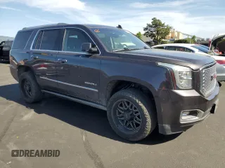 2015 GMC Yukon Denali with VIN 1GKS2CKJ8FR596848, listed as a Copart auction lot 52048105 with 129,935 mi miles and Salvage Title. Bid and sale history available at carsss.com. Image 4.