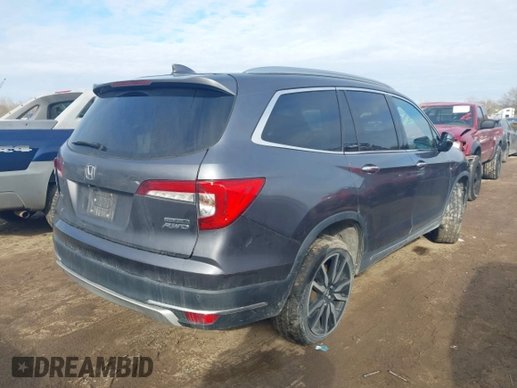 2019 Honda Pilot Touring 7-Passenger with VIN 5FNYF6H67KB018769, listed as a IAAI auction lot 41310452 with 92,499 mi miles. Bid and sale history available at carsss.com. Image 4.