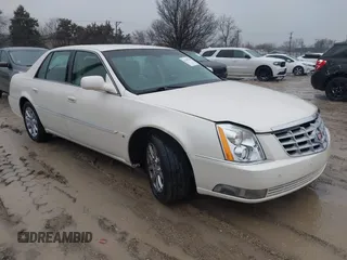 2009 Cadillac DTS 1SC z VIN 1G6KD57Y29U148665, wystawiony jako IAAI lot #41709730 z przebiegiem 80 565 mil mil oraz . Historia ofert i sprzedaży dostępna na DreamBid. Obrazek 1.