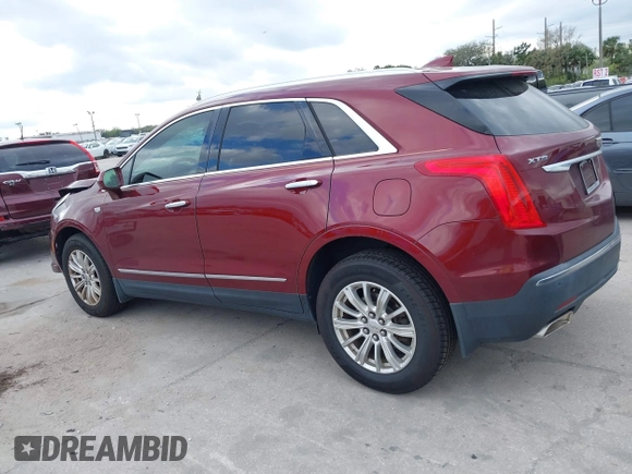 2017 Cadillac XT5 FWD with VIN 1GYKNARS2HZ107587, listed as a IAAI auction lot 41614842 with 124,611 mi miles and . Bid and sale history available at carsss.com. Image 14.
