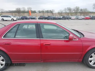 2001 Cadillac Seville z VIN 1G8KS54Y91U227846, wystawiony jako IAAI lot #42134095 z przebiegiem 216 766 mil mil oraz . Historia ofert i sprzedaży dostępna na DreamBid. Obrazek 13.