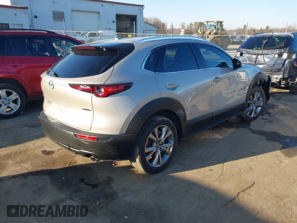 2024 Mazda CX-30 S Premium with VIN 3MVDMBDM9RM628162, listed as a IAAI auction lot 41262359 with 30,392 mi miles and . Bid and sale history available at DreamBid. Image 4.