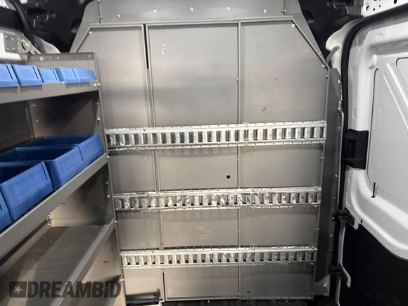 2023 Ford Transit Cargo z VIN 1FTBR1X85PKA75596, wystawiony jako IAAI lot #42742859 z przebiegiem 45 875 mil mil oraz . Historia ofert i sprzedaży dostępna na DreamBid. Obrazek 1.