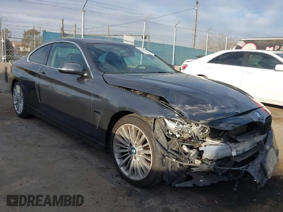 2014 BMW 4 Series 428i with VIN WBA3N7C5XEF719384, listed as a IAAI auction lot 41694678 with 115,517 mi miles and . Bid and sale history available at carsss.com. Image 1.