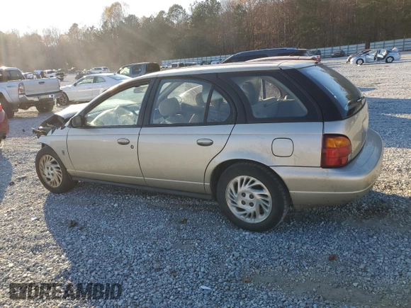 1999 Saturn SW z VIN 1G8ZK8277XZ162136, wystawiony jako Copart lot #83206604 z przebiegiem Nie podano mil oraz Szkody całkowita. Historia ofert i sprzedaży dostępna na DreamBid. Obrazek 2.