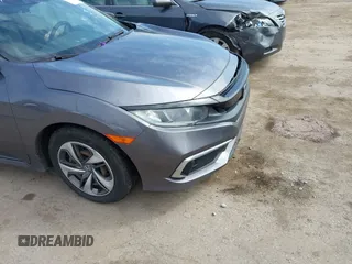 2019 Honda Civic LX with VIN 19XFC2F61KE037495, listed as a IAAI auction lot 41891007 with 90,262 mi miles and . Bid and sale history available at DreamBid. Image 6.