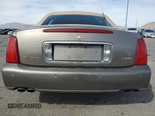 2002 Cadillac DeVille DHS z VIN 1G6KE57Y22U291523, wystawiony jako Copart lot #45711095 z przebiegiem 160 364 mil mil oraz Szkoda całkowita • Salvage title. Historia ofert i sprzedaży dostępna na DreamBid. Obrazek 6.
