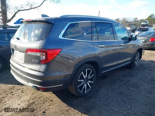 2022 Honda Pilot Touring 7-Passenger with VIN 5FNYF6H62NB010647, listed as a IAAI auction lot 41199560 with 102,066 mi miles. Bid and sale history available at carsss.com. Image 4.