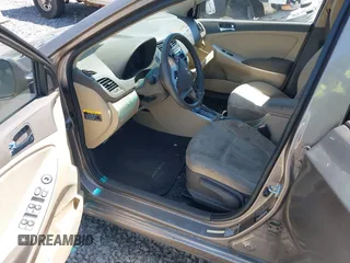 2014 Hyundai Accent GLS with VIN KMHCU4AE7EU736691, listed as a IAAI auction lot 42054514 with 80,715 mi miles and . Bid and sale history available at carsss.com. Image 5.