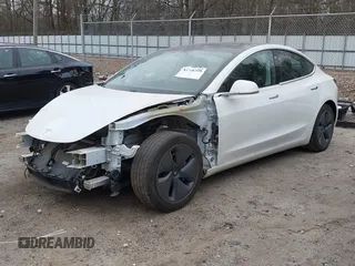 2020 Tesla Model 3 Standard Range Plus with VIN 5YJ3E1EA1LF799766, listed as a IAAI auction lot 41386508 with 90,000 mi miles. Bid and sale history available at carsss.com. Image 2.