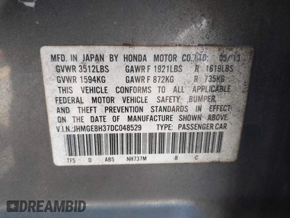2013 Honda Fit with VIN JHMGE8H37DC048529, listed as a IAAI auction lot 42011202 with 255,113 mi miles. Bid and sale history available at carsss.com. Image 9.