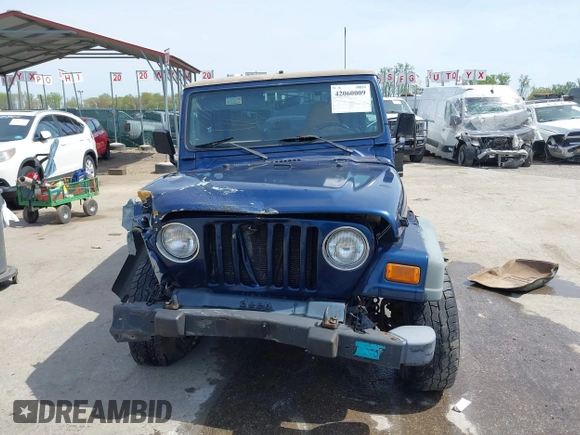 2000 Jeep Wrangler Sport with VIN 1J4FA49S5YP750123, listed as a IAAI auction lot 42060009 with Not Provided miles. Bid and sale history available at carsss.com. Image 12.